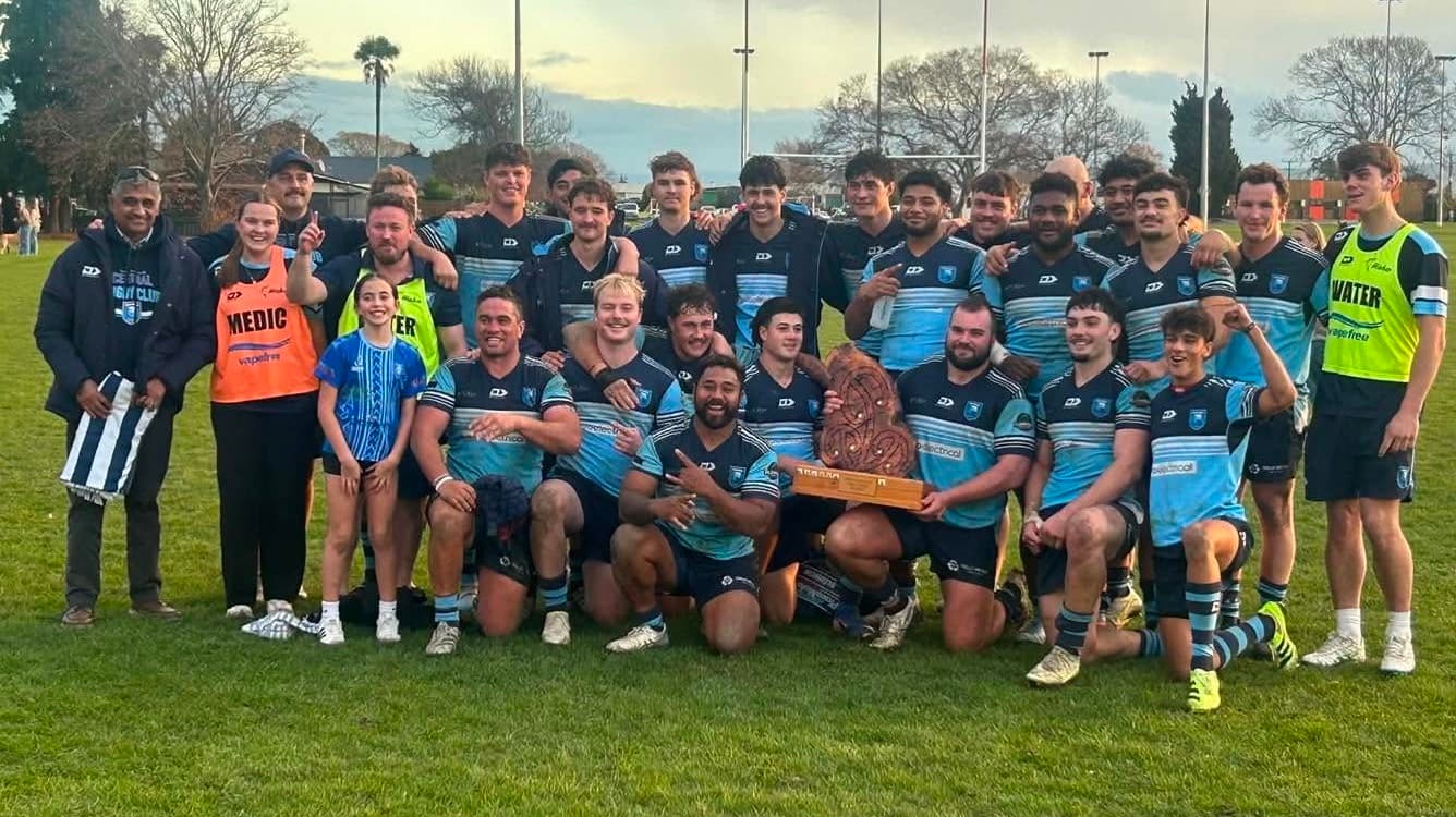 Local rugby team celebrating a win — one of the Marlborough community groups Biddy Kate's is proud to support