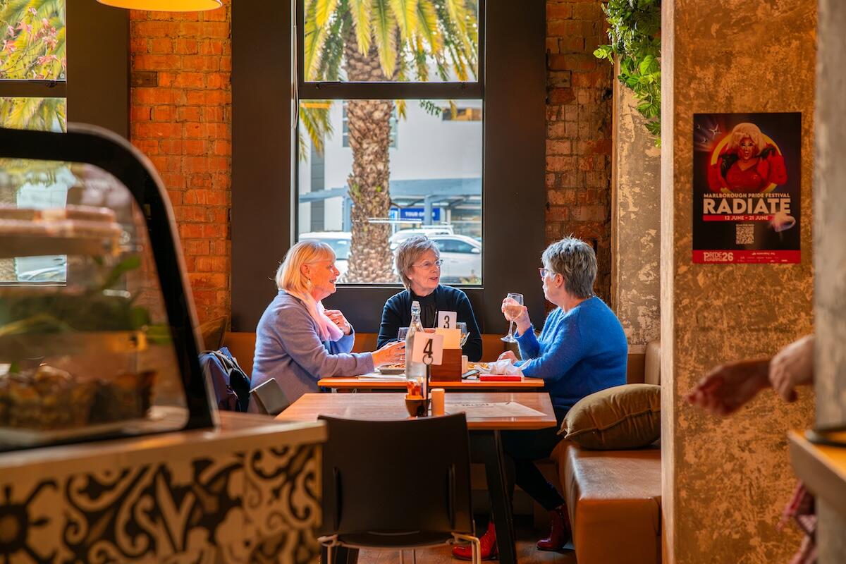 Guests enjoying lunch together at Biddy Kate's Cafe Bar, Blenheim